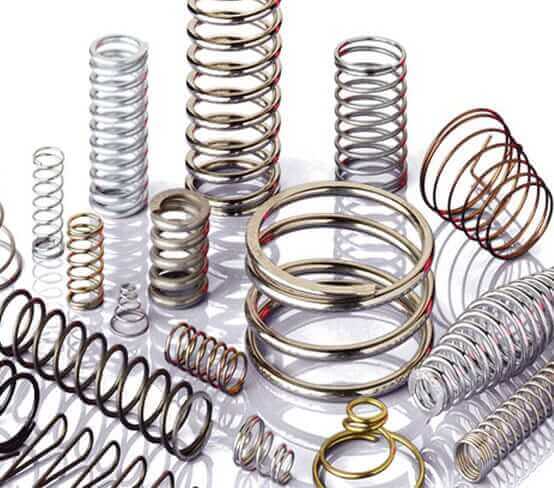 Springs manufactured from different materials A group of different styles of compression springs